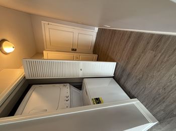 a small bathroom with a washer and dryer in it